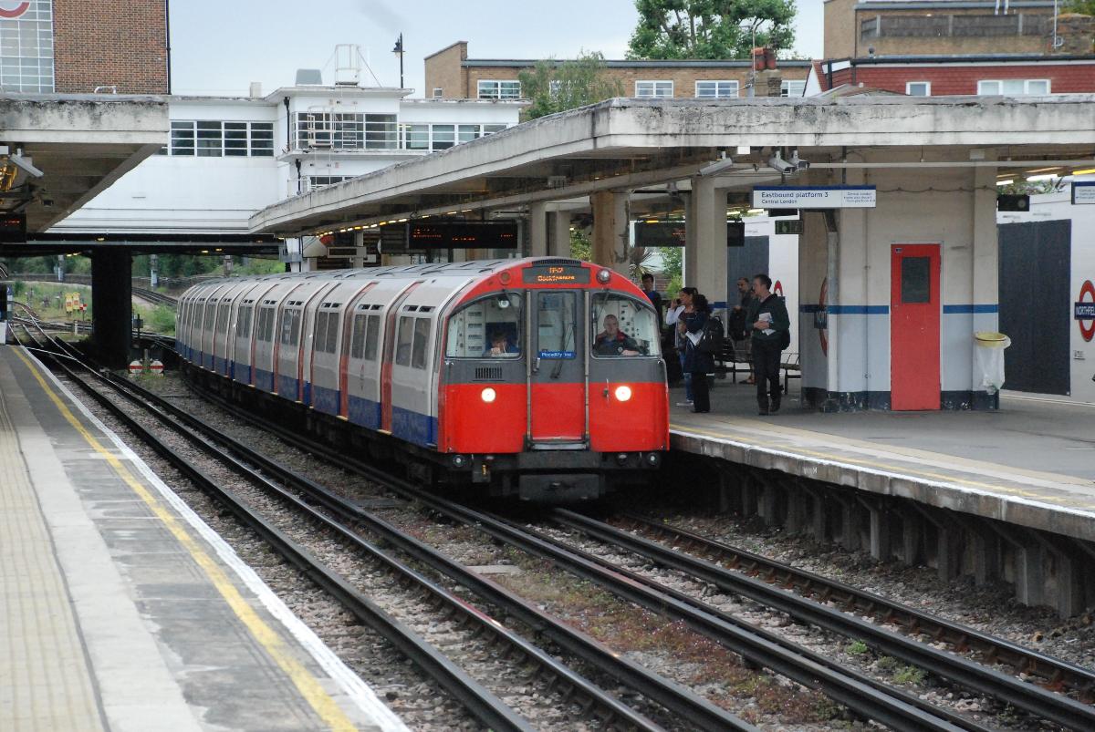 Double ended unit of 1973 Stock (lead car No.874) entering Northfields Platform 3 on a Cockfosters service 