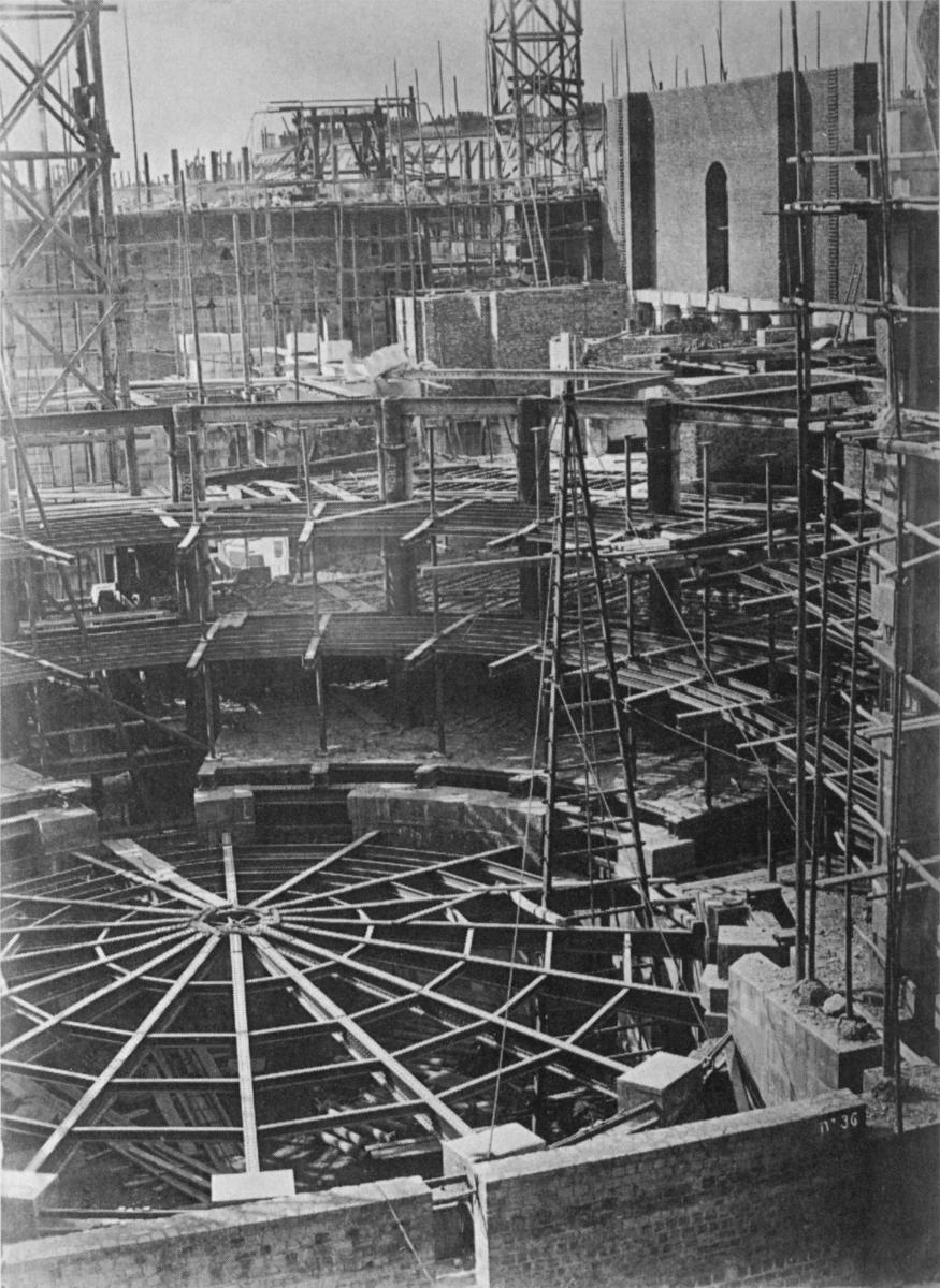 Opéra Garnier en construction Photograph of the auditorium during construction of the Palais Garnier of the Paris Opera. The iron floor trusses form the vault of the future "Rotonde des Abonnés". The ironwork of the walls is being put in place, and the first two levels of trusses for the boxes have been added.