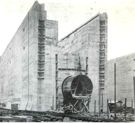 Media File No. 209476 The Panama Canal locks under construction, in 1910. The partly-constructed middle wall is shown here; the large pipe near the bottom is the culvert used to carry water into the locks. The man standing below and right of it illustrates the scale From The Panama Canal , An address to the National Geographic Society, by Colonel Goethals, February 10, 1911