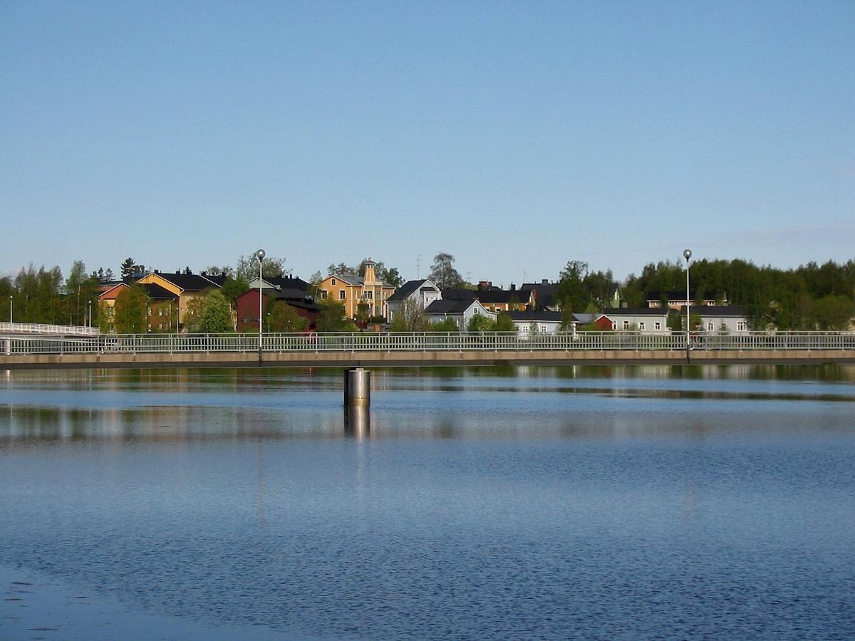 Pikisaari with a pedestrian and bicycle bridge in the foreground 