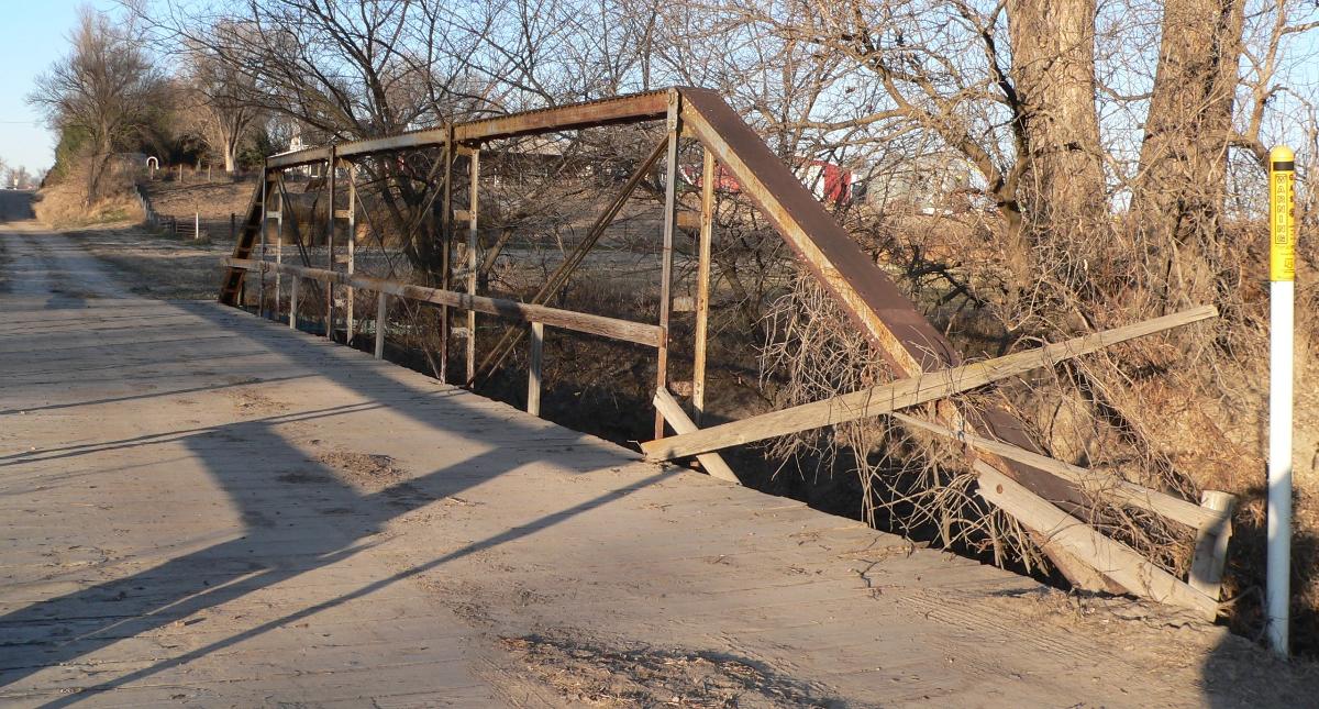 East (downstream) truss of Sweetwater Mill Bridge in Buffalo County, Nebraska The pin-jointed Pratt pony truss bridge carries Sweetwater Road across Mud Creek. It was built in 1909 by the Standard Bridge Company, and is listed in the National Register of Historic Places.