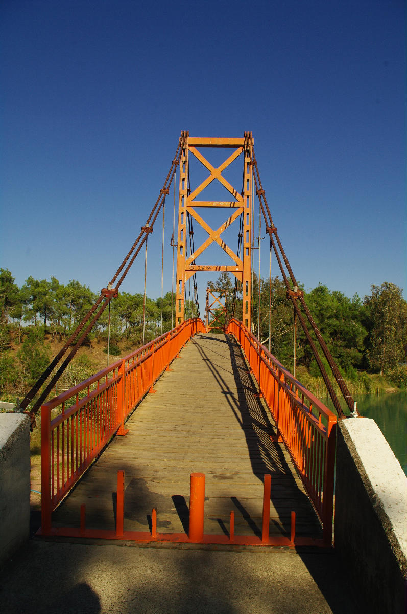 View of "Gençlik Köprüsü" (literaly meaning Youth Bridge in Turkish) over Eski Baraj Dam Lake part of Seyhan River. Adana - Turkey. 