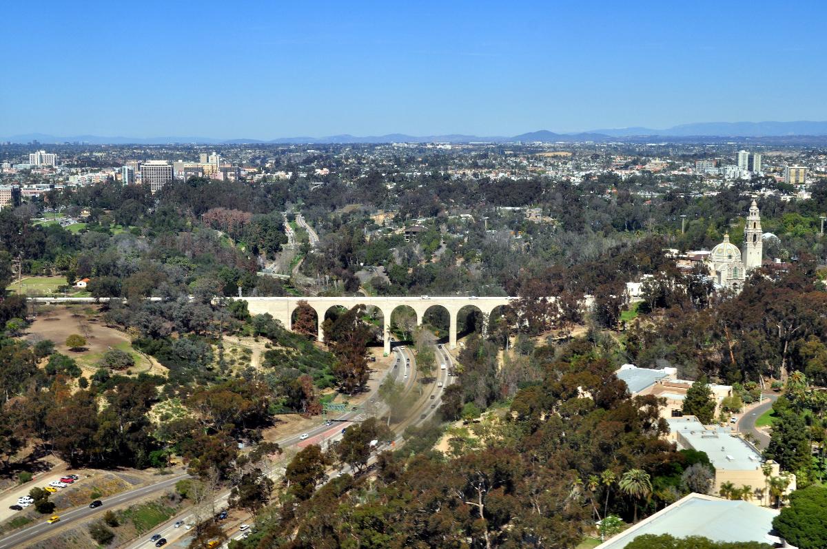 Low aerial view of Cabrillo Bridge and Museum of Man, San Diego, California 