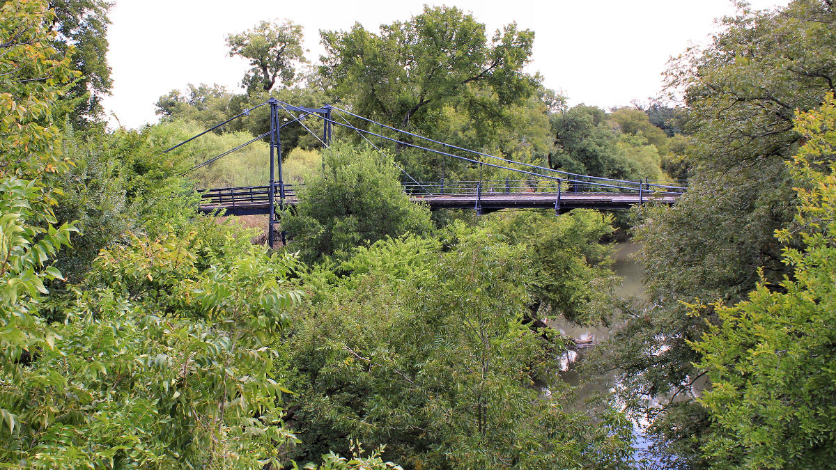 The Beveridge Suspension Bridge over the San Saba River in San Saba County, Texas, United States. 