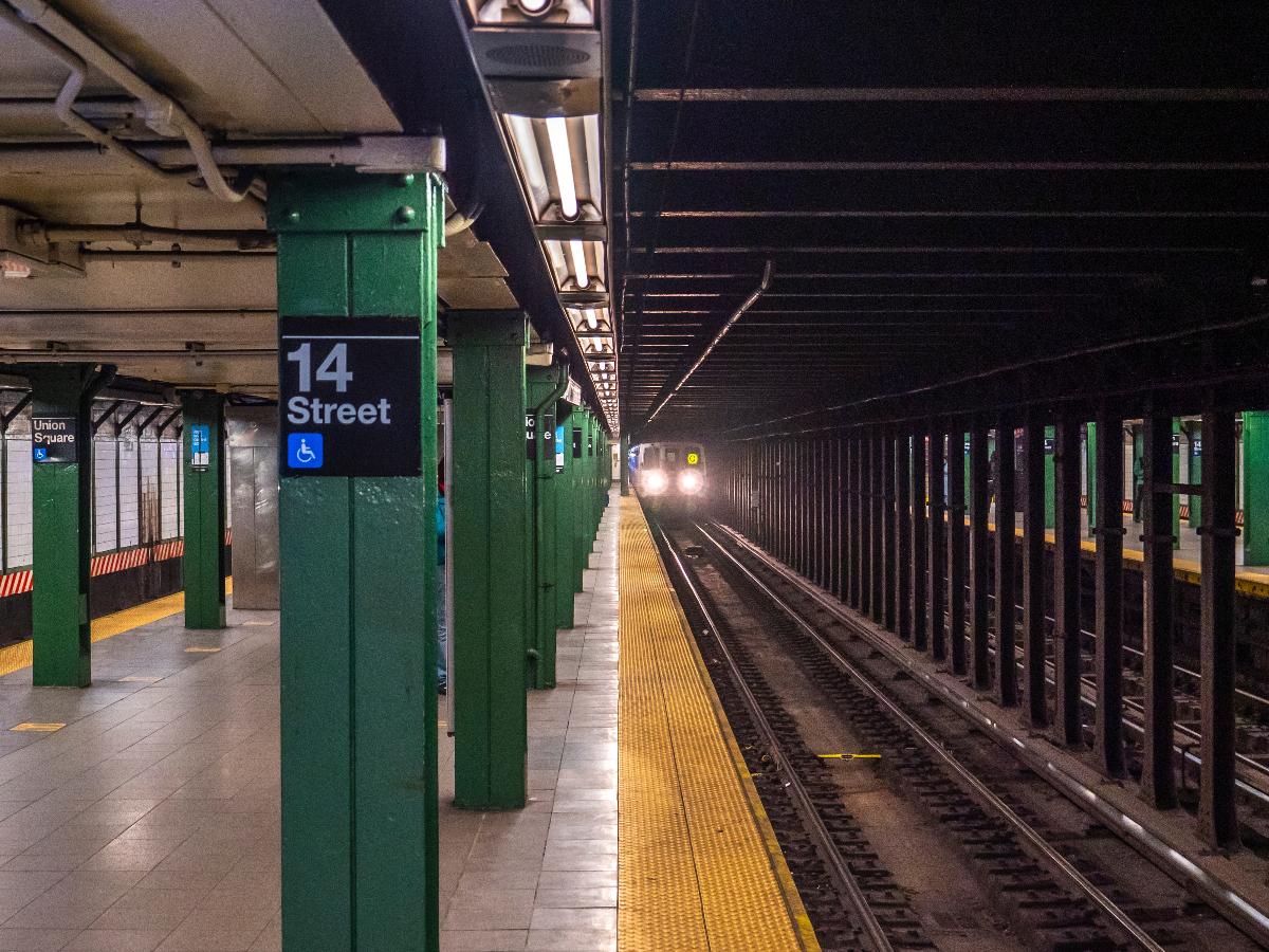 A view from the southbound platform of the BMT Broadway Line's 14th Street station. An R46 Q train is arriving. 