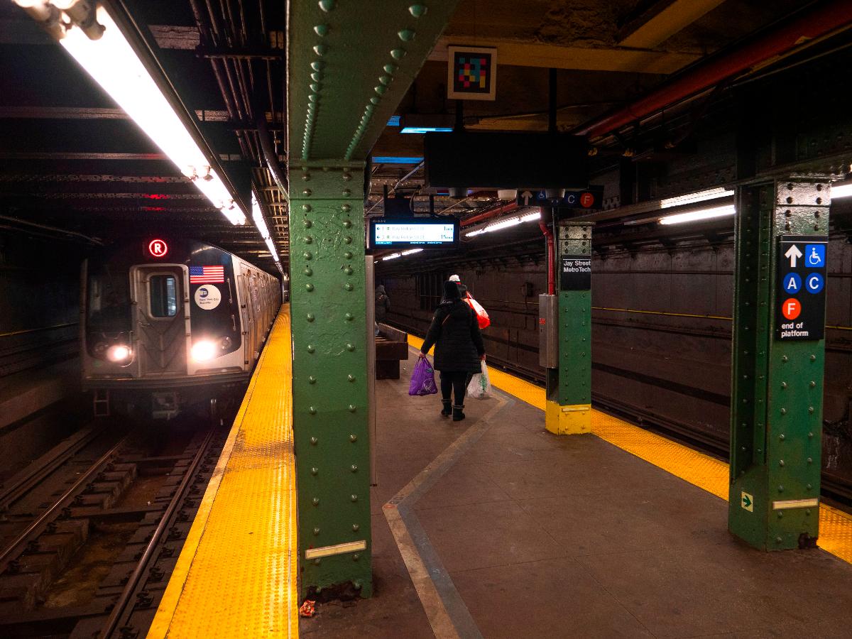 The R train platform at Jay Street-Metrotech, originally called Lawrence Street before the connection to Jay Street-Borough Hall was completed A southbound R160 R train is arriving.