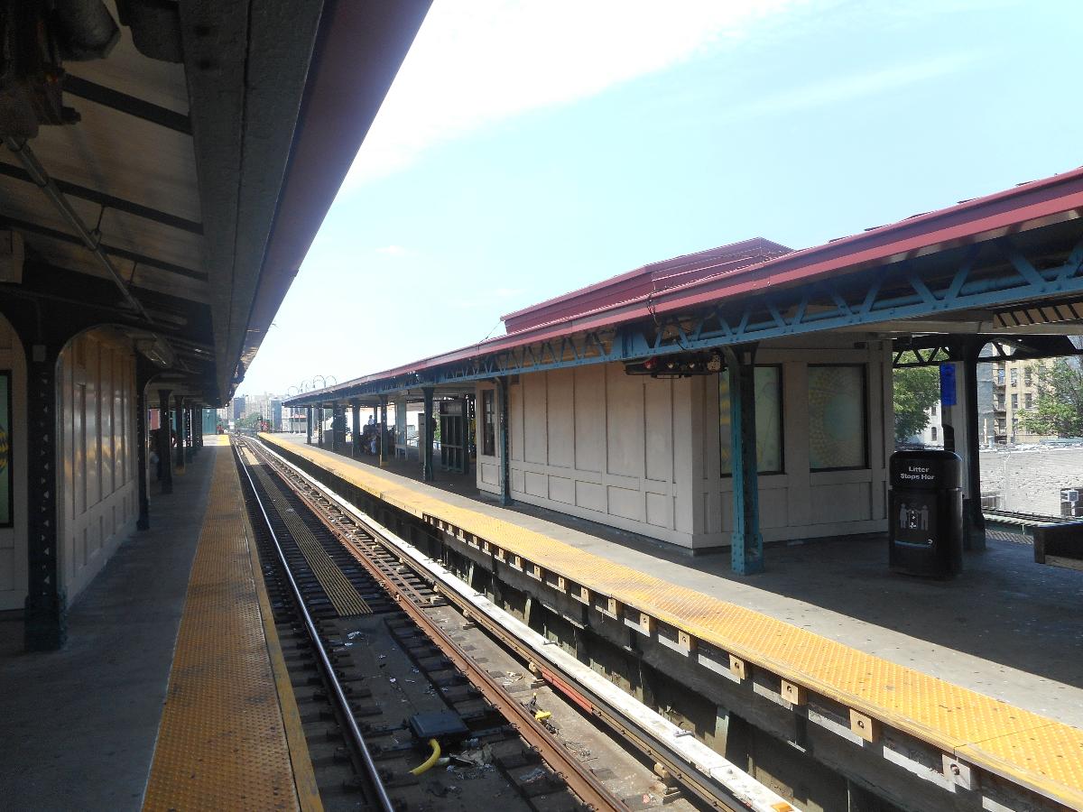 Burnside Avenue Subway Station (Jerome Avenue Line) The express tracks facing south around one of the sheltered staircases along the Woodlawn-bound platform at Burnside Avenue Elevated Railroad Station on the IRT Jerome Avenue Line between the Morris Heights and University Heights sections of the West Bronx, in New York City. The sheltered staircase along the Manhattan and Brooklyn-bound platform can be seen on the right. Both shelters lead to the same station house below the tracks and above the street. A horizontal subway signal can also be seen under the Manhattan and Brooklyn-bound platform too.