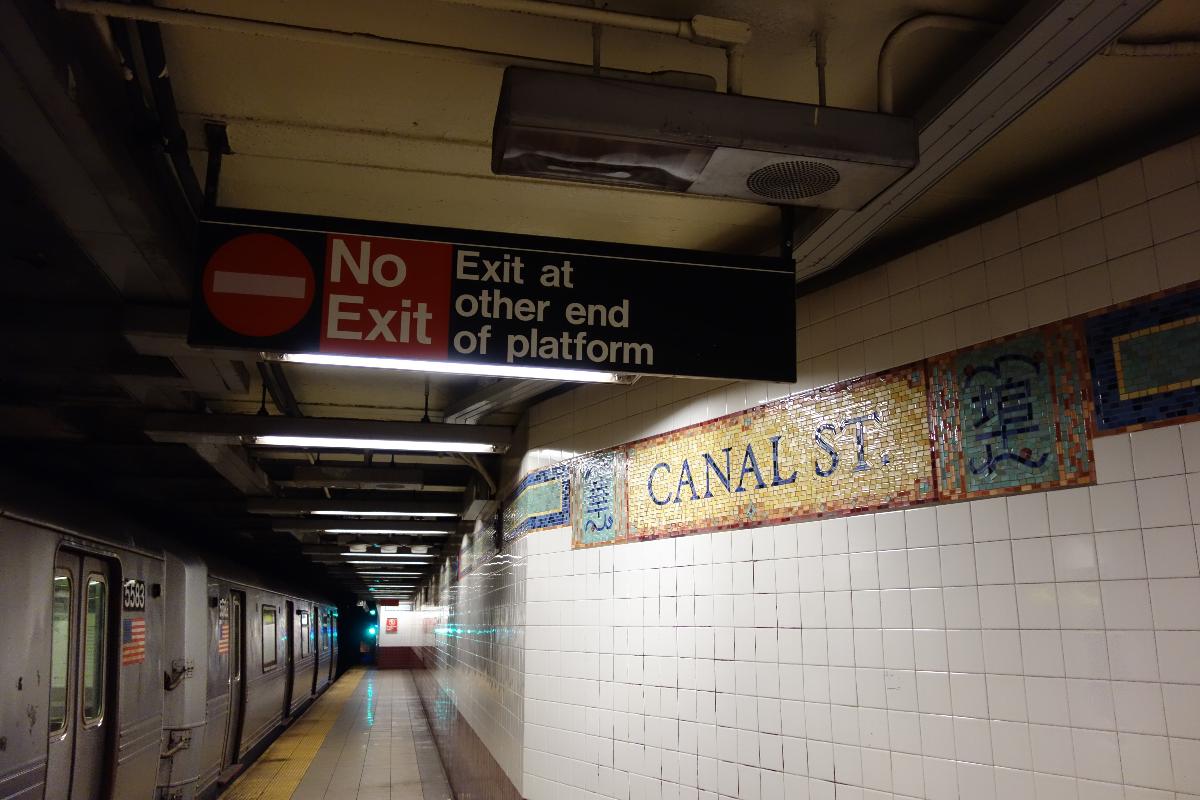 The Downtown local platform of the Canal Street BMT Broadway Line station, under Canal Street and Broadway in Chinatown, Lower East Side, Manhattan. 