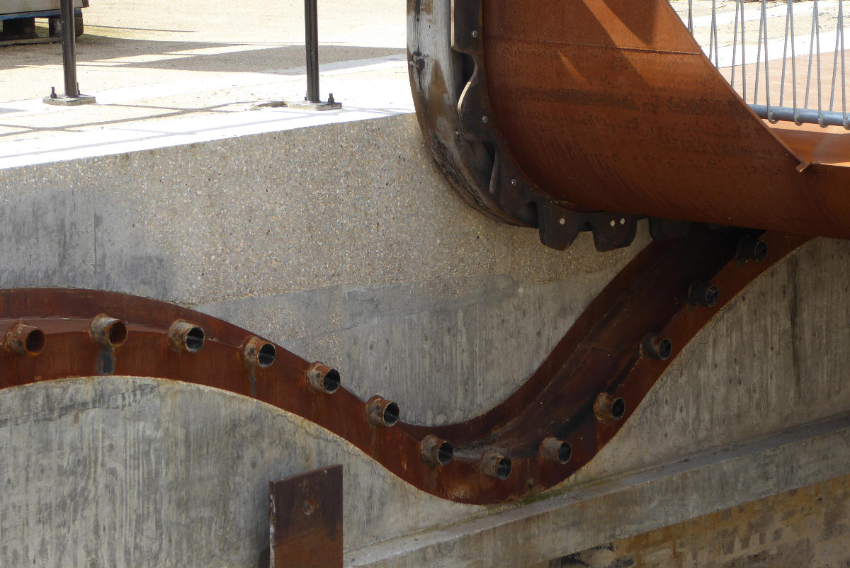 Detail of the Cody Dock Rolling Bridge designed by Thomas Randall-Page The square cog design, rolling on catenary curve tracks - together with a balanced centre of gravity - enables the bridge to be rolled between higher and lower positions with minimum effort.