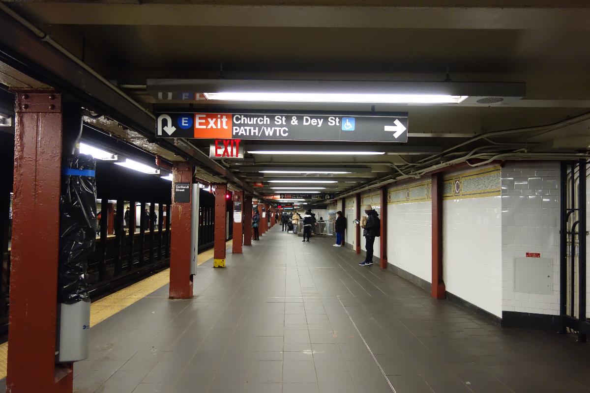 Cortlandt Street station Looking south along the Brooklyn-bound platform of the Cortlandt Street station of the BMT Broadway Line in the Financial District, Manhattan. Pictured is an exit sign pointing to the WTC Transportation Hub.