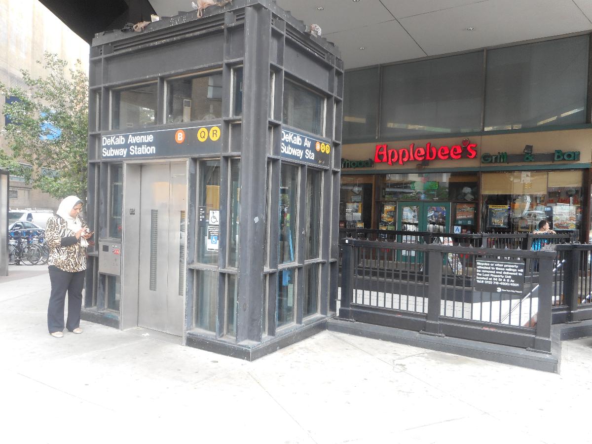 DeKalb Avenue Subway Station (Fourth Avenue Line) The combined staircases and elevator for the DeKalb Avenue Subway Station on the BMT Fourth Avenue Line in Downtown Brooklyn, on the southeast corner of Flatbush Avenue and DeKalb Avenue in front of an Applebee's Restaurant.