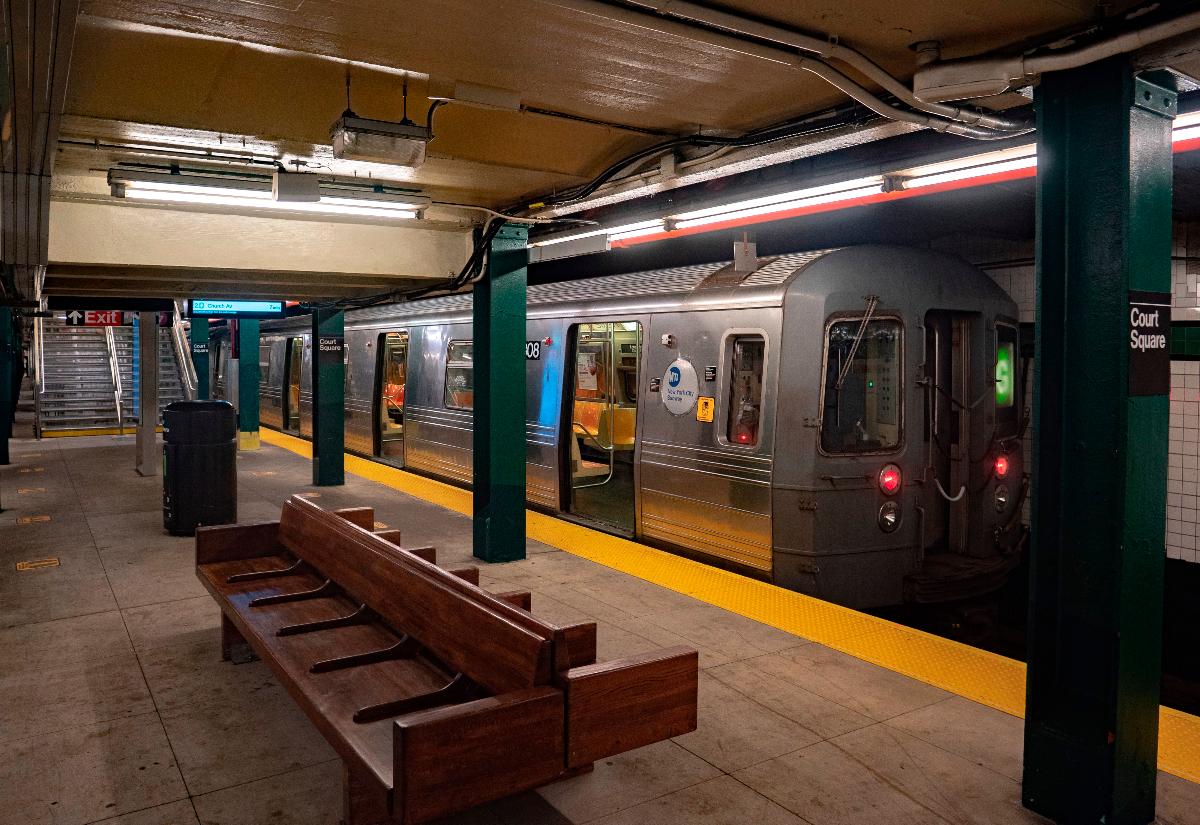 An R68 G train boarding at the platform of the IND Crosstown Line's Court Square station 