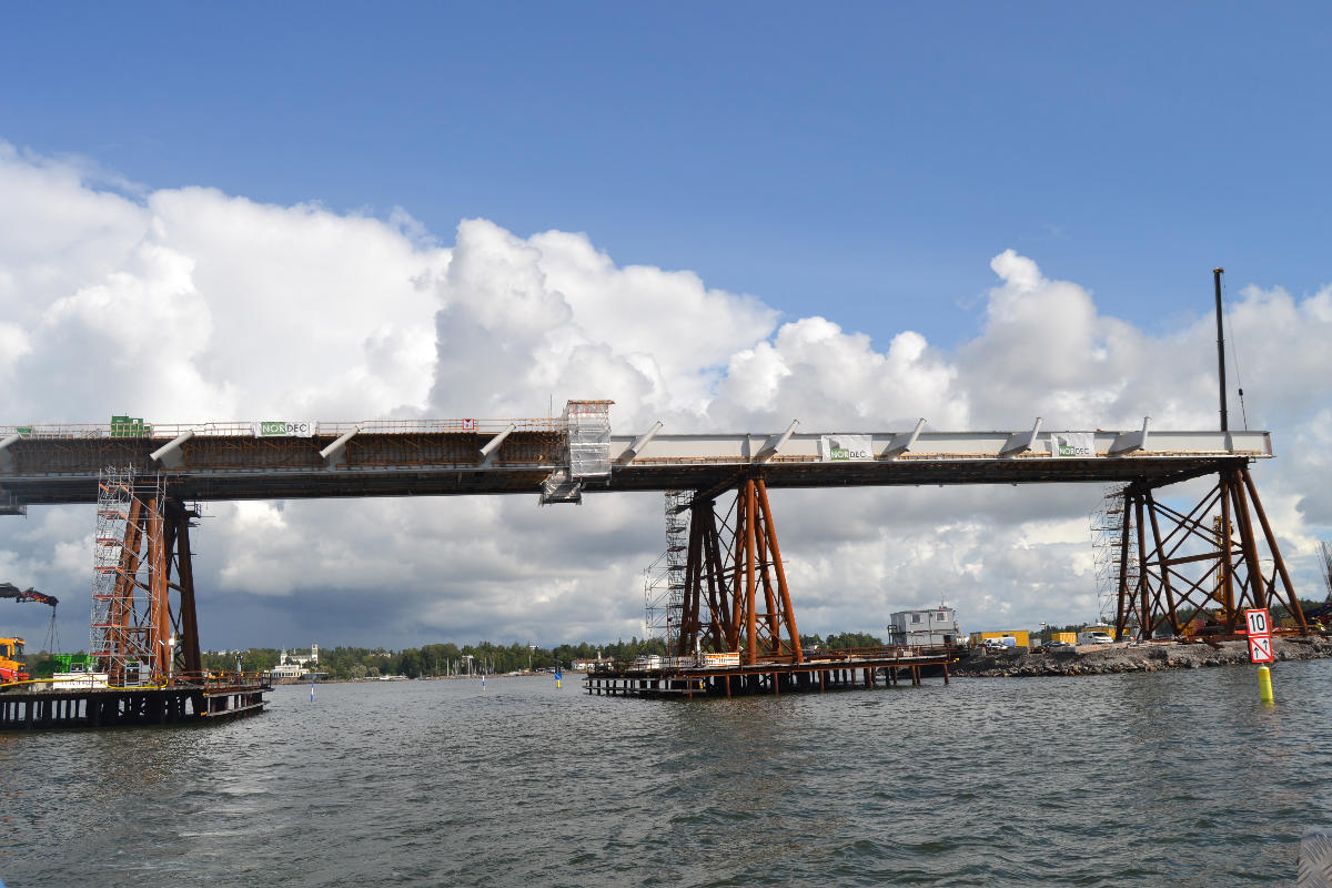 Kruunuvuori Bridge in Helsinki under construction as seen from the waterway passing under it 