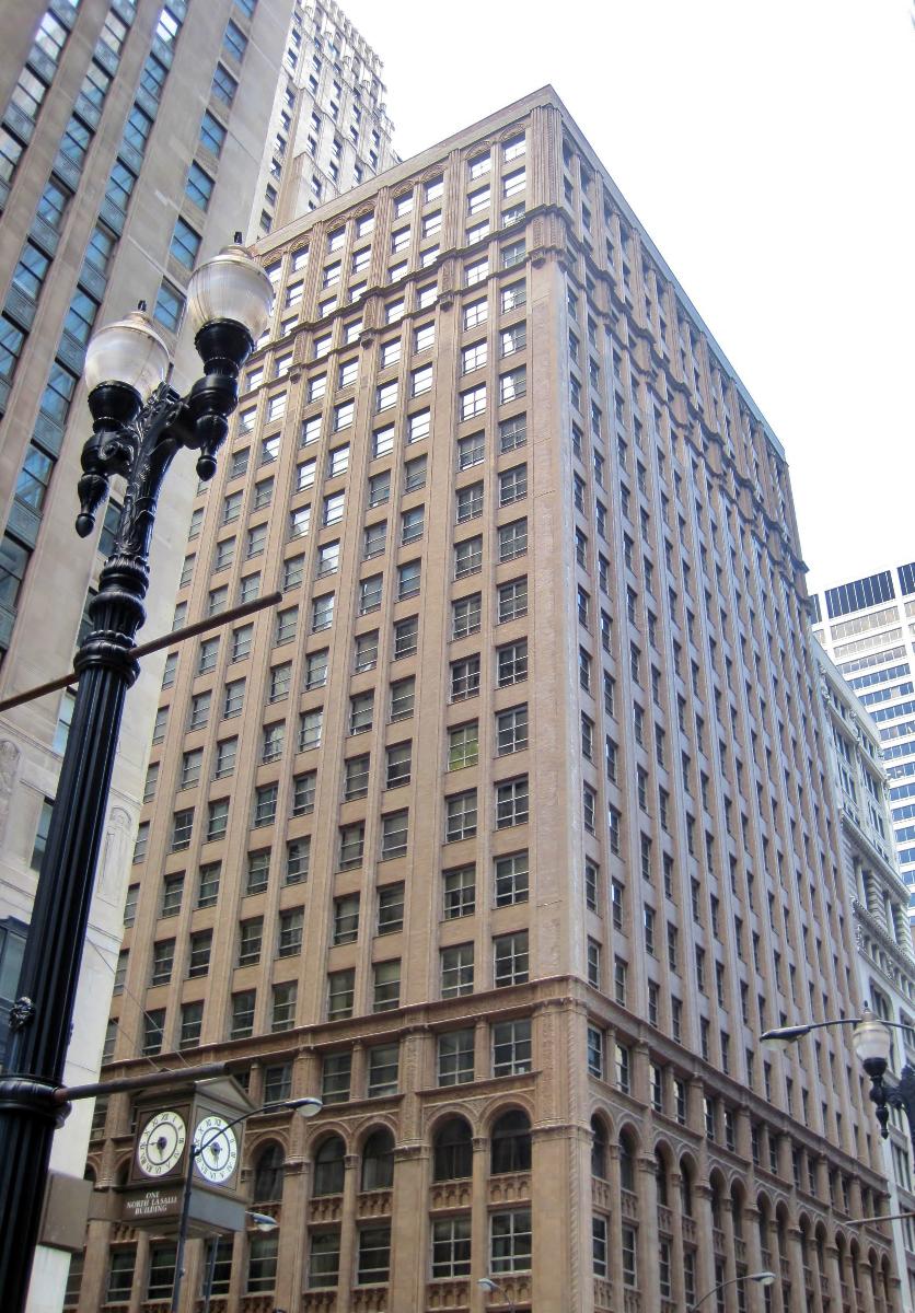 The Lumber Exchange Building and Tower Addition in Chicago (1925) The original 16 stories were built in the Chicago style in 1915. A 35-story tower was added onto the building in 1925. The building was the longtime host of the Sidley &amp; Austin law firm.