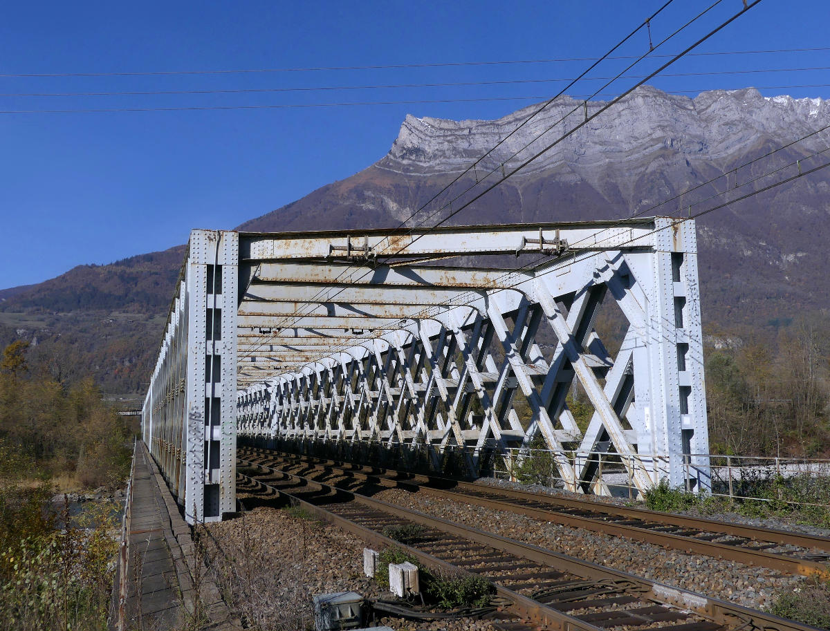 Sight of railway bridge crossing river, in , . 