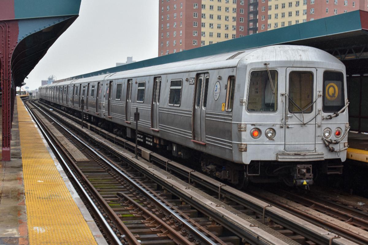 A Coney Island bound Q train made up of R46s leaving West 8th to head towards its next and last stop 
