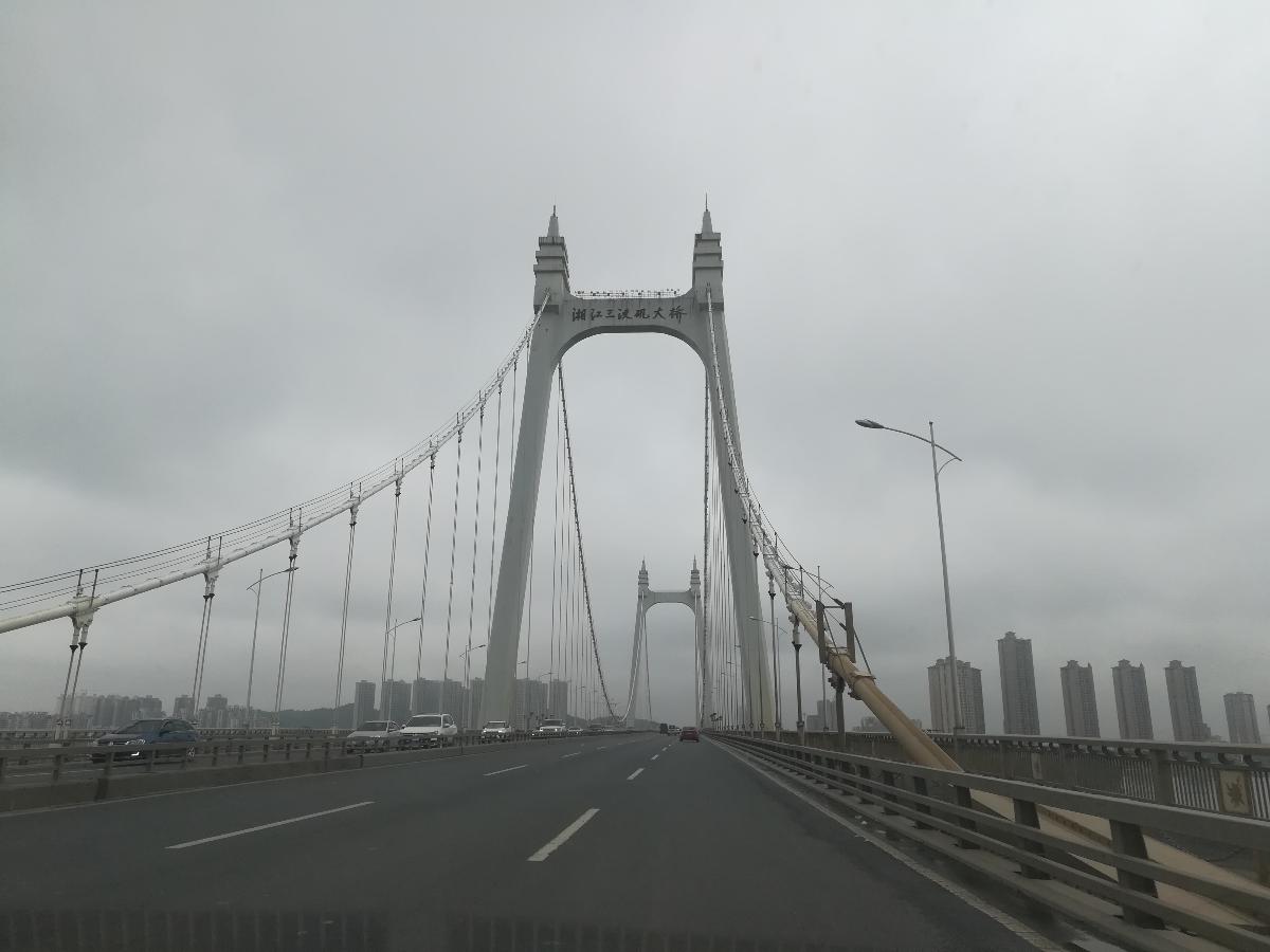 The Sanchaji Bridge is a suspension bridge in Changsha, Hunan, China Completed on June 8, 2006, it has a main span of 732-metre (2,402 ft) and total length of 1,577-metre (5,174 ft). It is signed as part of the North Second Ring Road.