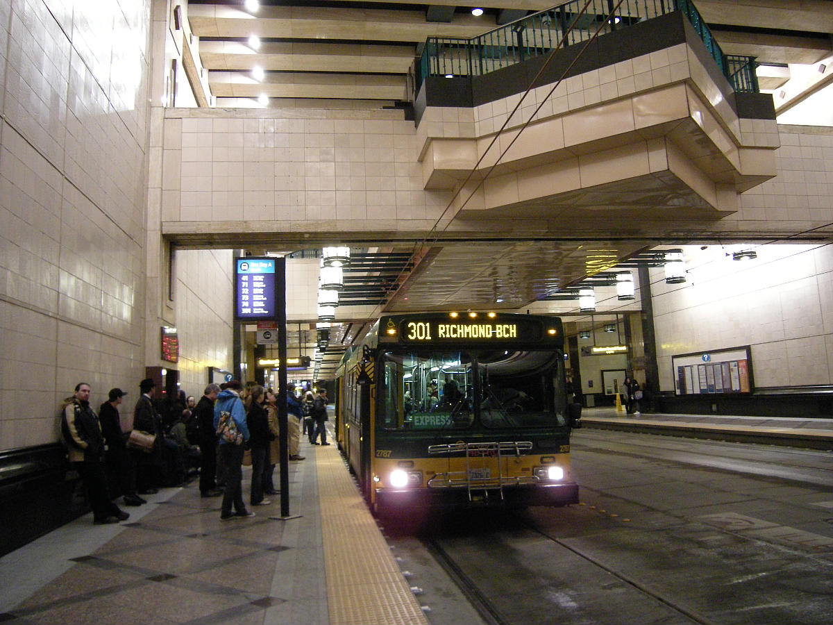 Passenger boarding a bus, Westlake Station, Seattle, Washington. 