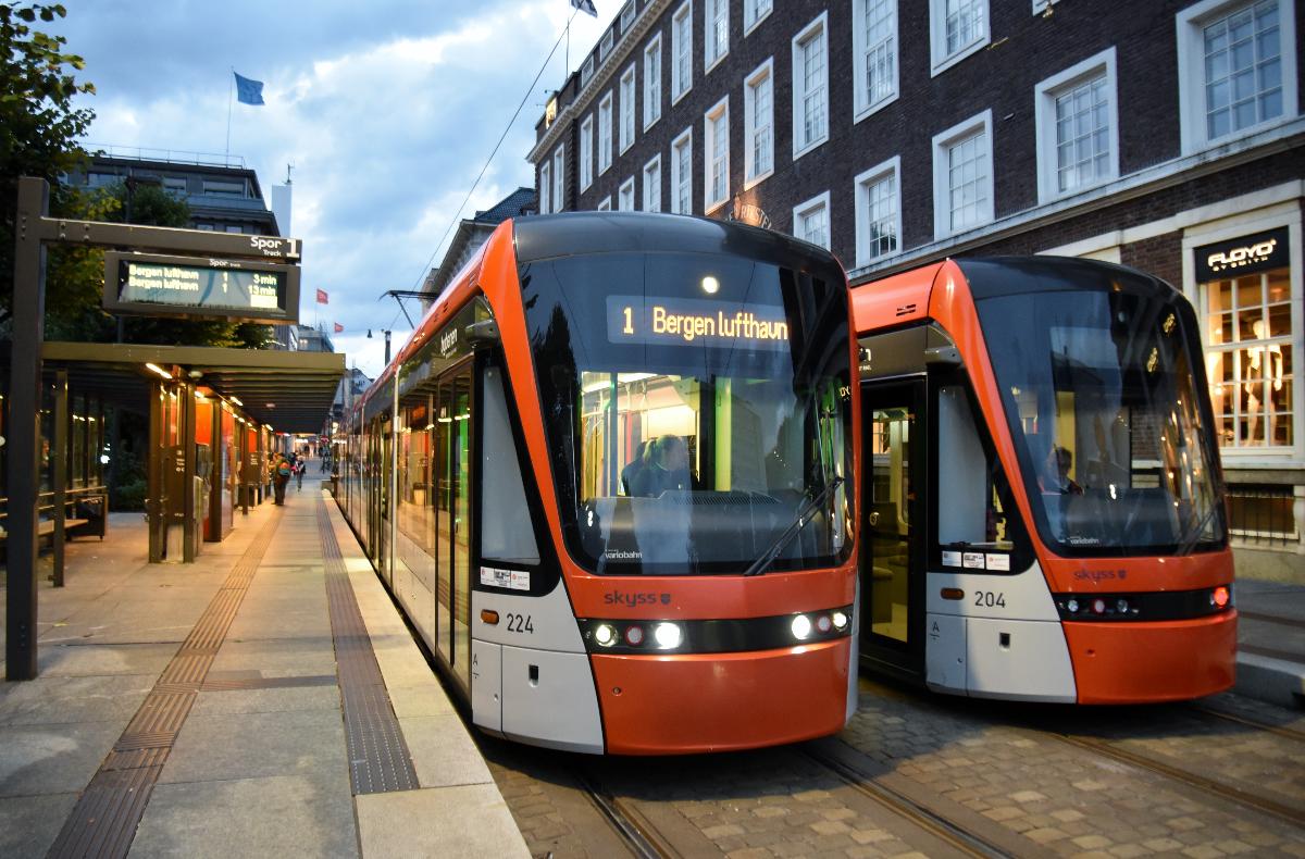 Bergen Light Rail trams nos. 224 (left) and 204 (right) awaiting departure from, and laying over, prior to departing as a line 1 service to Bergen Airport light rail stop.