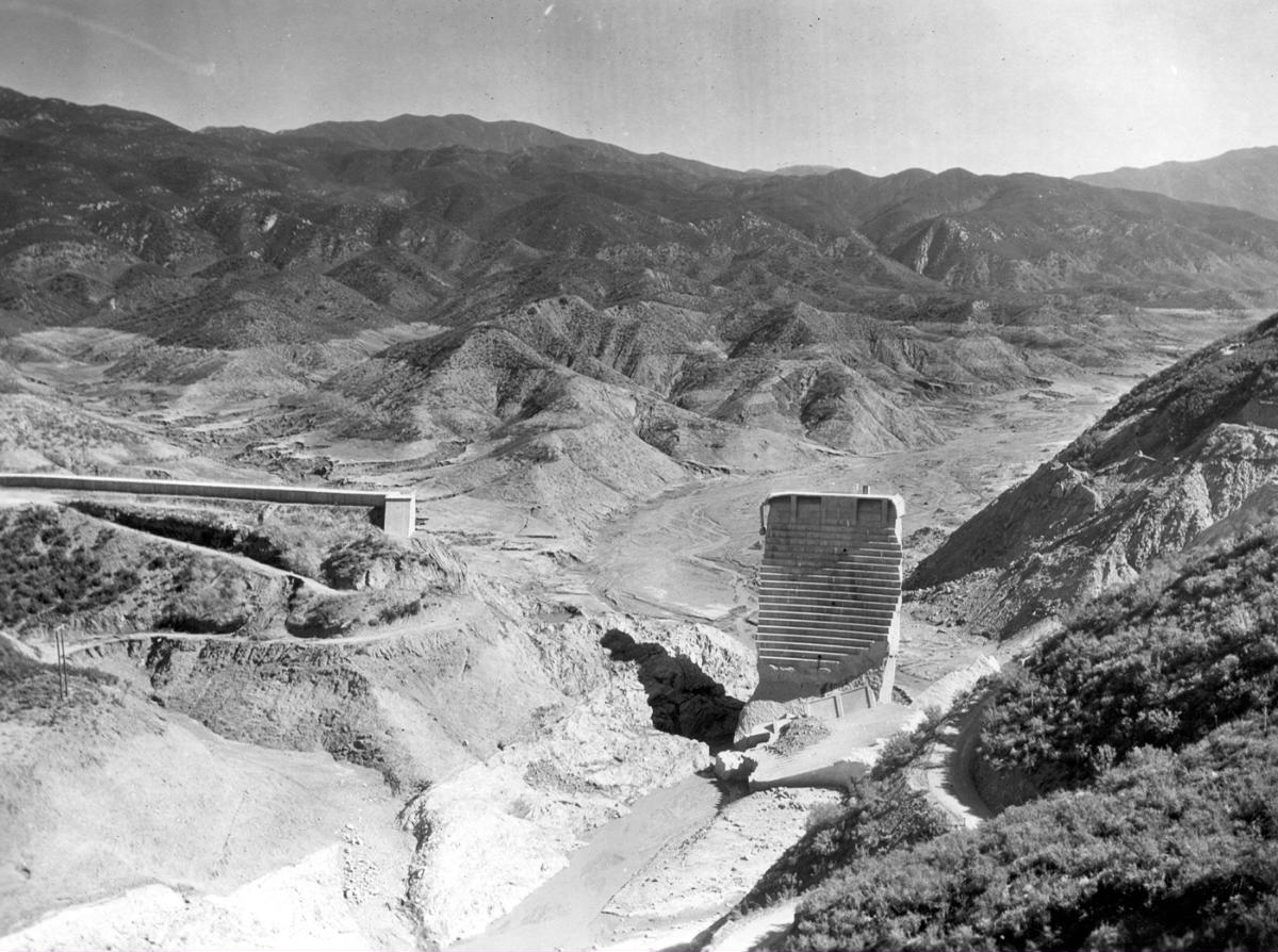 Media File No. 427246 Flood March 12-13, 1928, Los Angeles County, California. Taken from the same location as , showing the remains of the dam and reservoir floor. The dam failed at 11:58:30 p.m. Monday March 12, 1928. The left (west) abutment of the dam was entirely swept away and the inactive San Francisquito Fault is clearly visible, being located along the contact zone of schist and conglomerate.