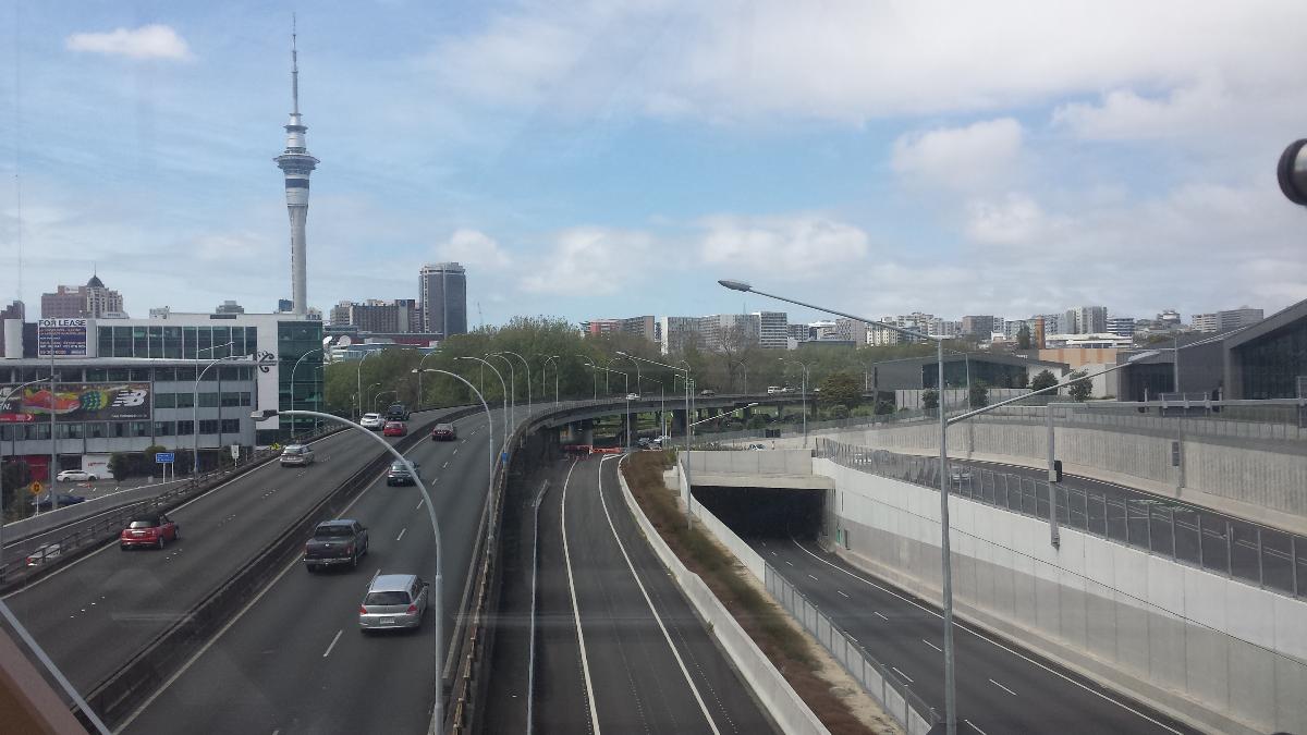 Victoria Park Tunnel View of the State Highway 1 and the northern portal of the Victoria Park Tunnel with the Sky Tower and Auckland skyline in the background. The photo was taken from the Jacobs Ladder Footbridge